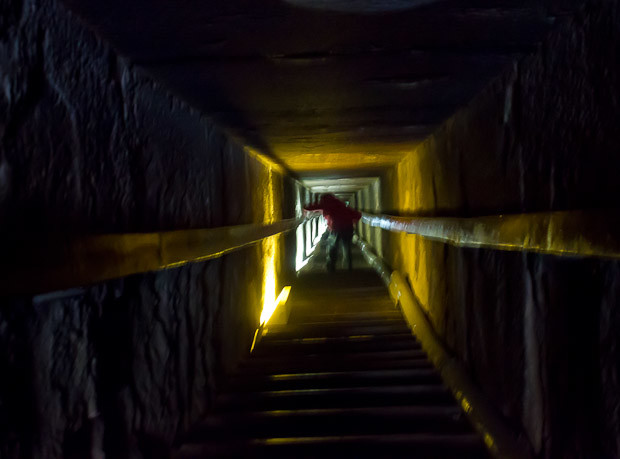 Inside the Red Pyramid Z scrambling down into the Red Pyramid, Dahshur, Cairo, Egypt,