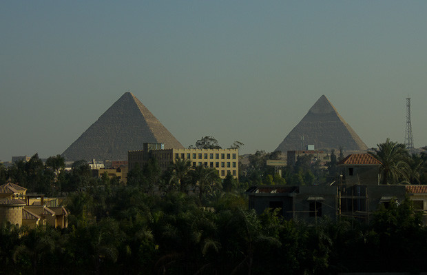Pyramids in Cairo The pyramids of Giza loom out of suburban Cairo.