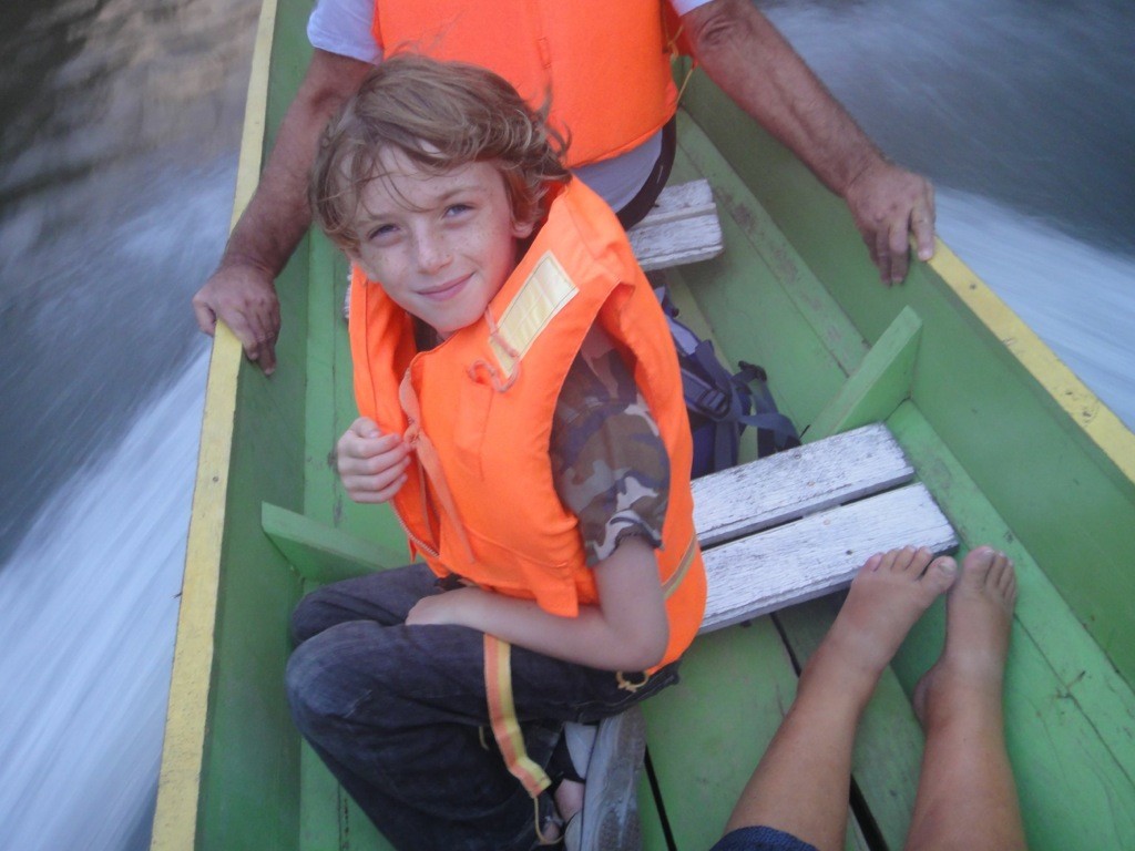 DSC03173 Z in orange lifejacket in longboat en route to Mulu National Park with his grandparents.