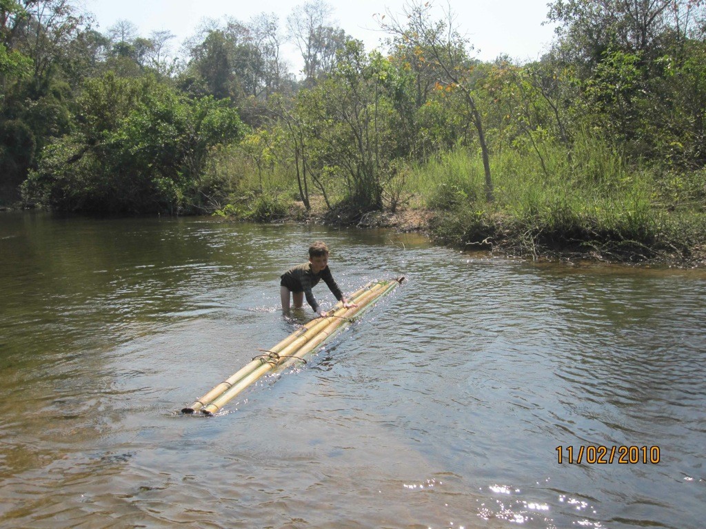 making_bamboo_raft_virachey_national_park In the water, making a bamboo raft in Virachey National Park, Cambodia