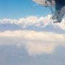 Flying into Lukla - Twin Otter wing over Himalayas.