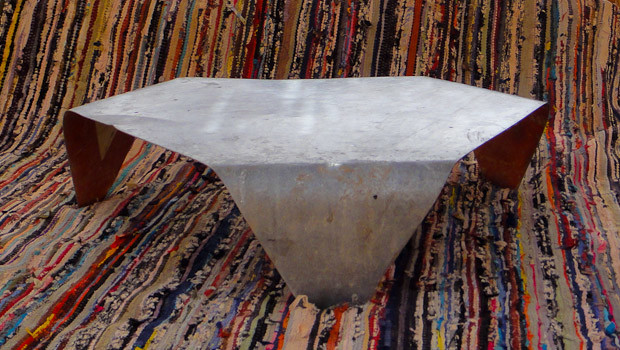 Bedouin Table 1 Triangular zinc table on Bedouin carpet in the Sinai.