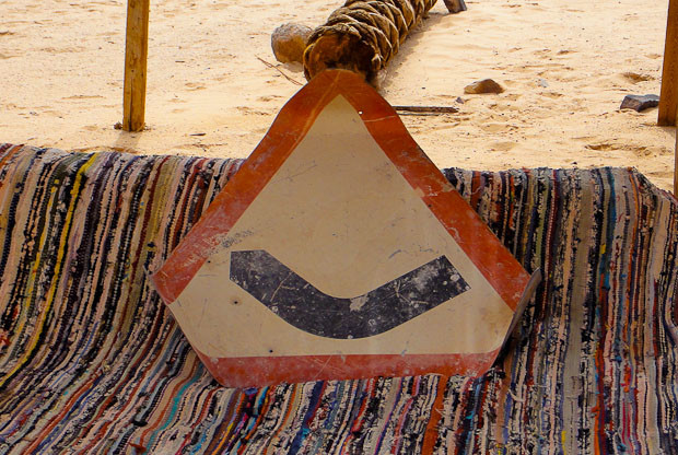 Bedouin Table 2 Upturned table reveals itself to be a steep bend road sign.
