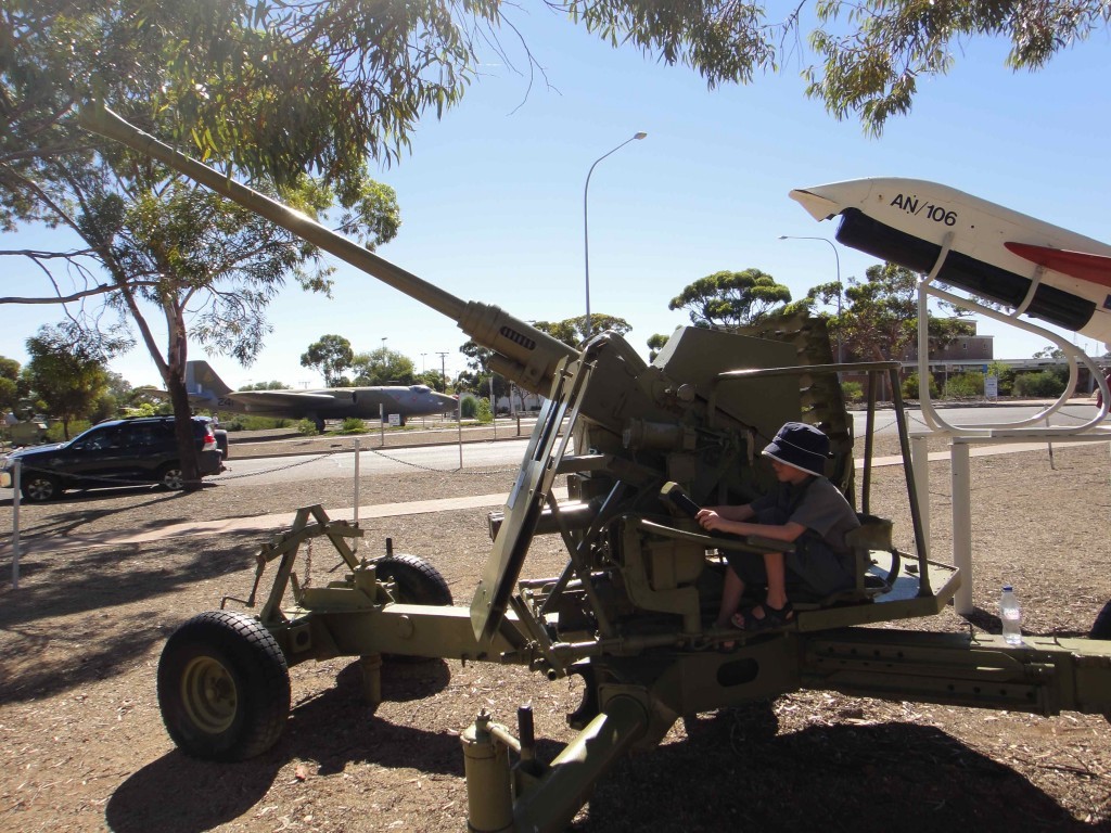 Z pretending to fire a WWII Bofors gun, Woomera, South Australia