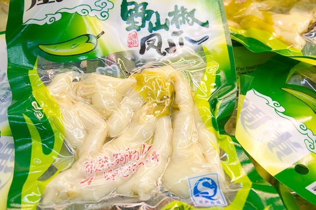 Chinese Supermarket Chicken Feet Chicken claw packaged for sale in a Chinese supermarket.