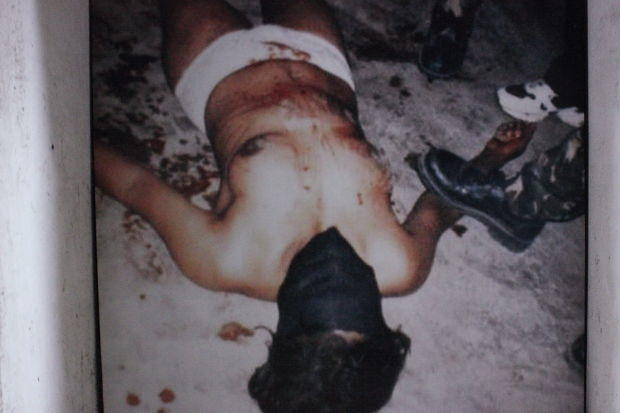 Dili Balide Prison Timor Leste Victim Female prisoner, hooded, bloodied and in underwear, in Balide Prison, Timor Leste.