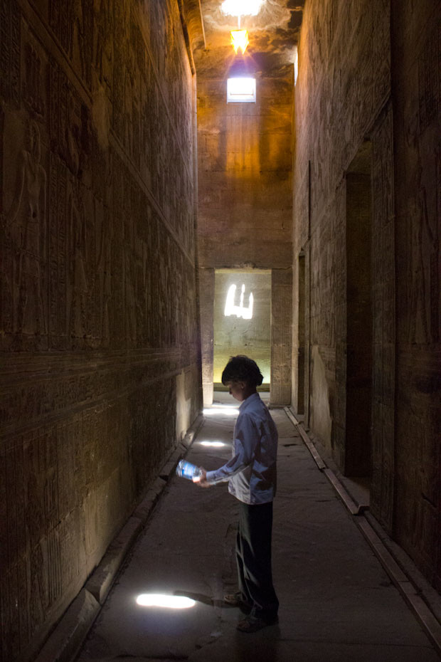 Edfu- young Indy Z in one of the corridors at the temple of Horus in Edfu, Egypt.