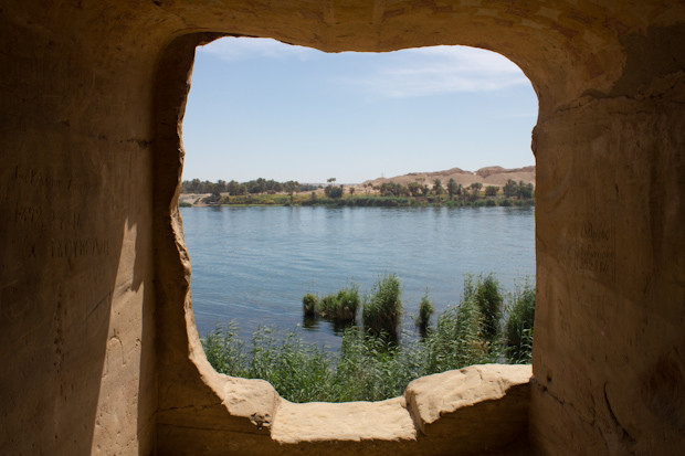 Felucca trip- rock cut tomb in Gebel Silsila Nile view from a rock cut tomb in Gebel Silsila: sandstone frames the river and islets.