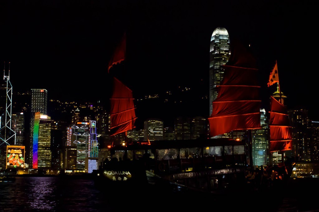 Junk passing Christmas lights in Hong Kong harbour.