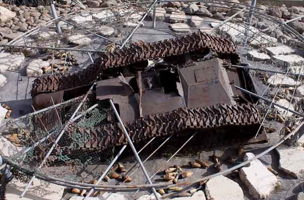 Mleeta HezbollahLand Lebanon-3 Upturned tank on abstract sculpture with rocks and razor wire, Mleeta, AKA HezbollahLand.