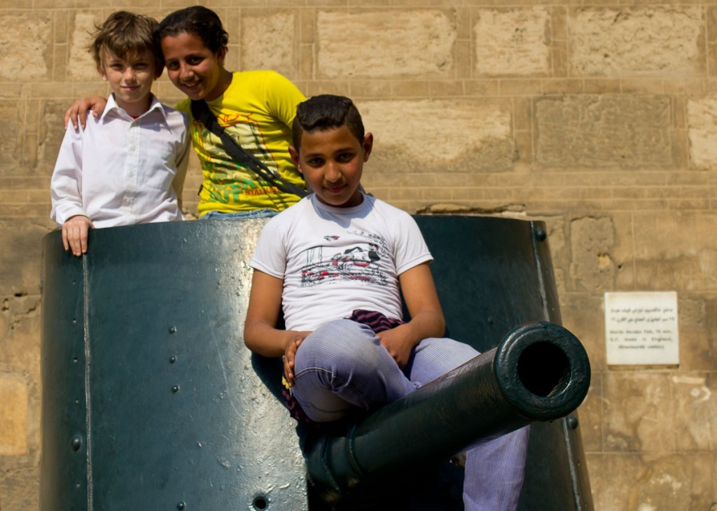 Sitting on a tank with some Egyptian kids outside the military museum in Cairo.