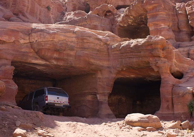 Petrafied in Petra-10 Car parked in cave tomb at Petra.