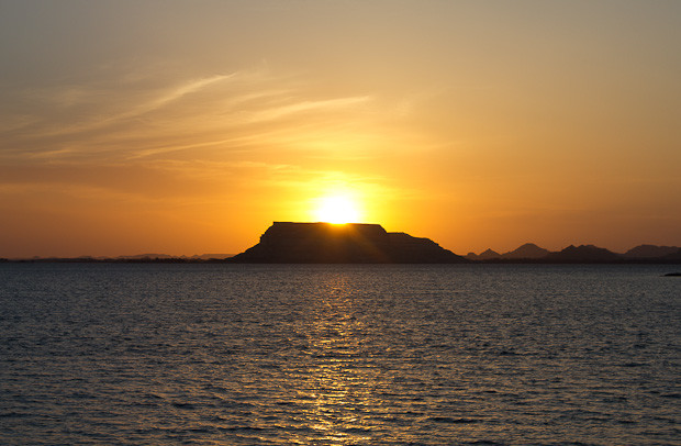 Siwa- Salt Lake sunset Sun sets behind an island on a salt lake outside Siwa.