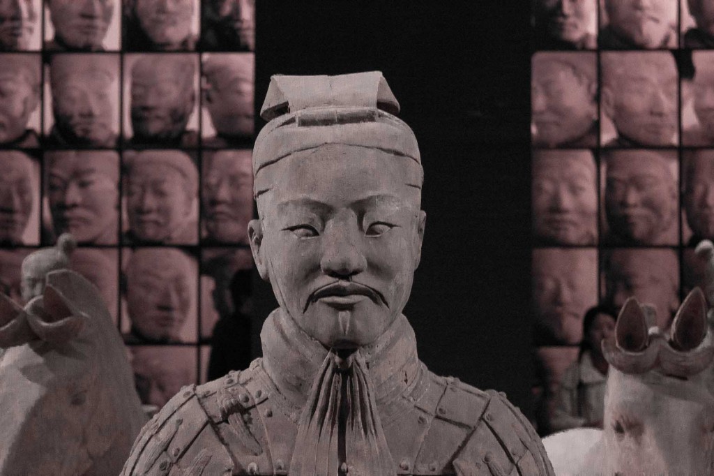 Terracotta Warriors -- senior officer backed by portraits of other men in Shaanxi Museum, Xi'an.