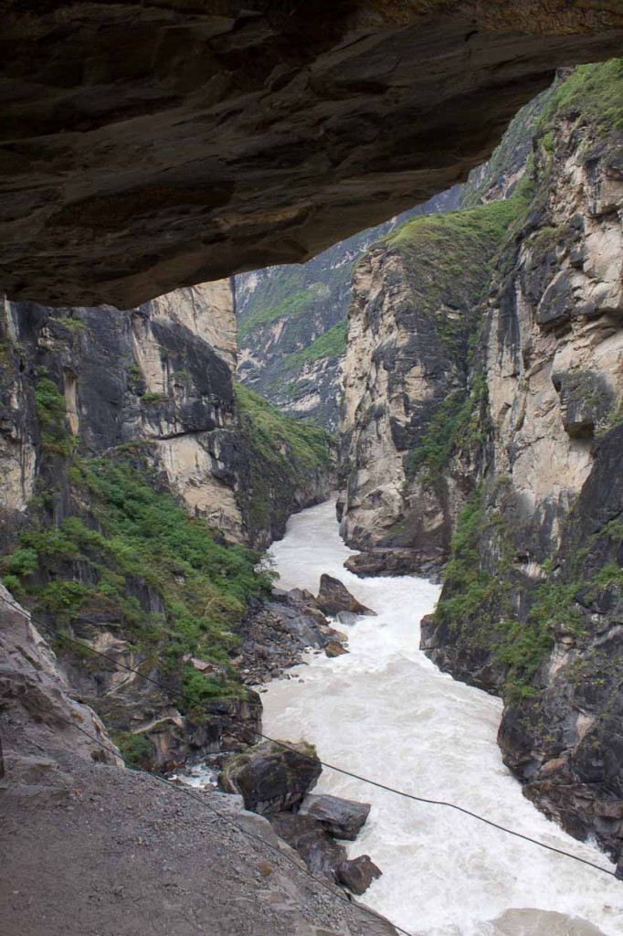 Path in overhanging cliff and Yangzi river - Tiger Leaping Gorge.