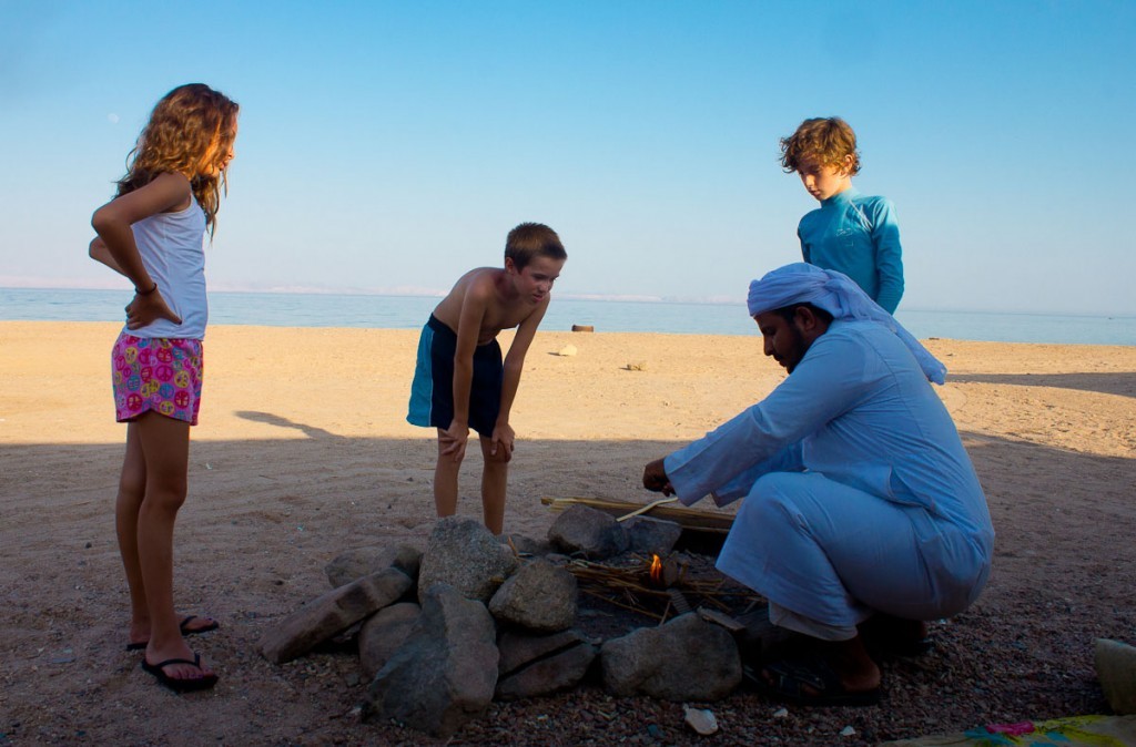 Watching a Bedouin making a fire on the beach.