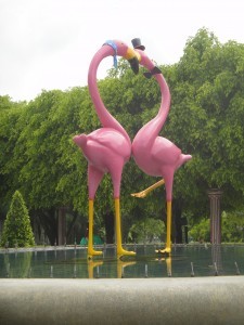 Plastic pink flamingoes intertwined at Dreamworld, Bangkok.