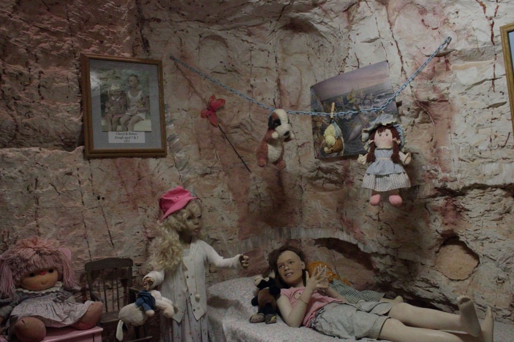 plastic models of young girls in 1970s dugout home, coober pedy, south australia