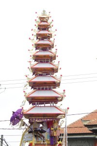 Bali cremation: funeral tower spinning, high above the roof tops, to confuse the demons.