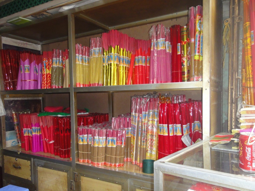 incense_store_hanoi_vietnam Incense sticks on shelves, incense store, hanoi, vietnam.
