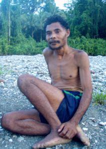 Lima on the riverbank Lima in his football shorts on the stony banks of the river