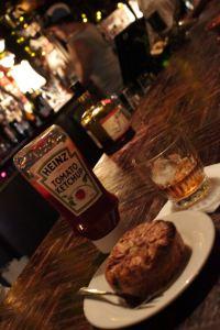 meat pies meat pie and tomato ketchup on a bar