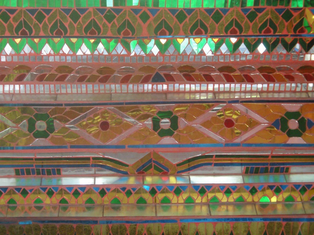 mirrored_mosaics_wat_chiang_man_chiang_mai Repeating patterns of mirrored mosaics, altar of side temple, Wat Chiang Man, Chiang Mai, Thailand.