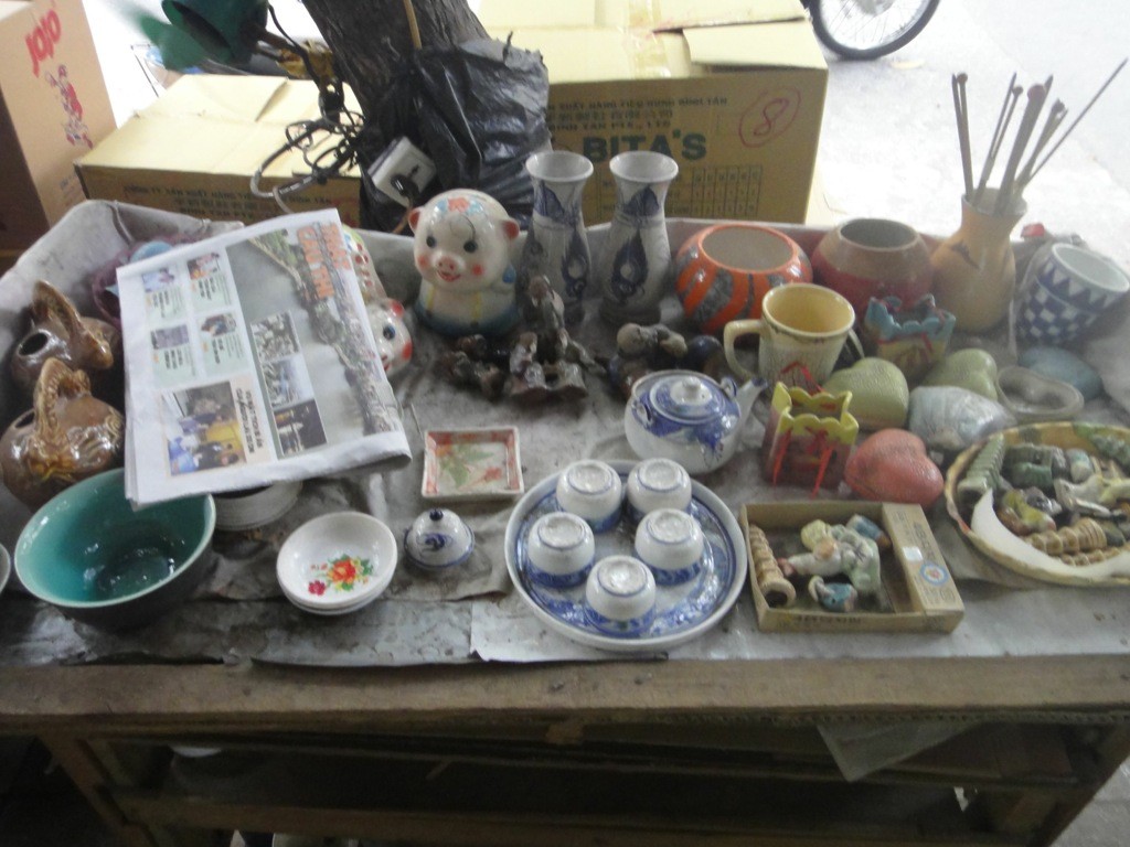 outside_art_store_hanoi_vietnam Table with pottery outside an art store/stationers, Hanoi, Vietnam.