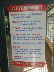 Warning sign on tiger cage, Tiger Kingdom, Chiang Mai, Thailand.