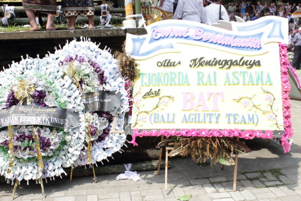 funeral wreaths outside the royal palace ubud: one is from the Bali Agility Team