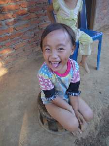 Young Hmong girl with big smile, village near Luang Namtha, Northern Laos.