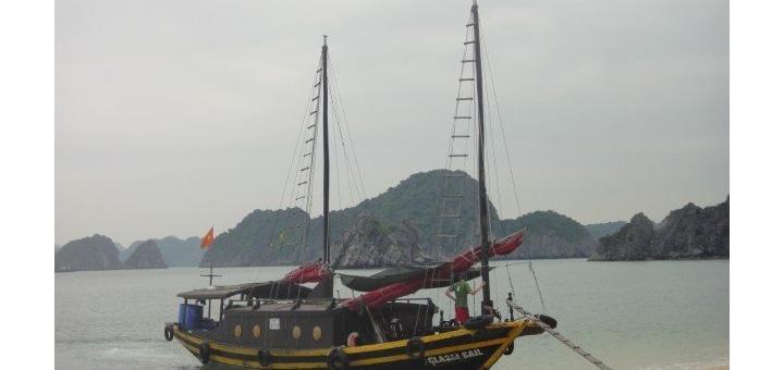 Junk moored on beach of Monkey Island, near Halong Bay, Vietnam