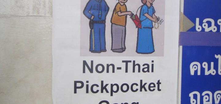 Poster warning of "non-Thai pickpockets", Wat Pho, Bangkok