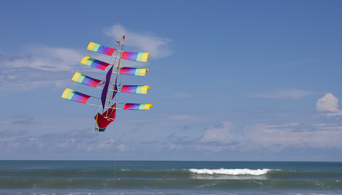 Flying kites on Seminyak beach, Bali.