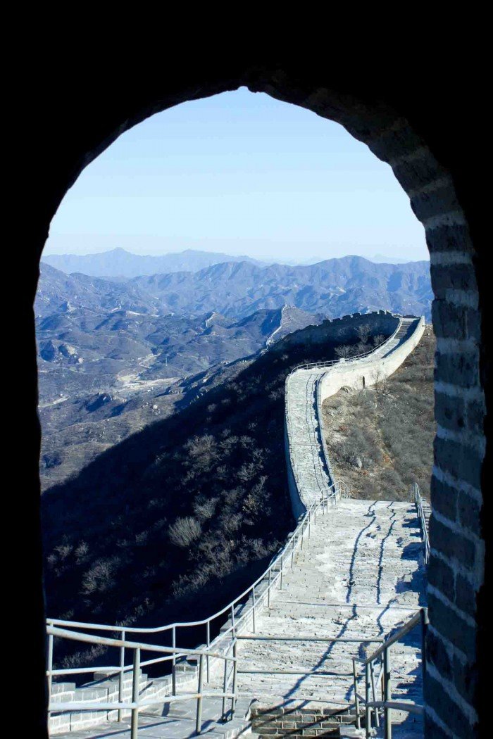 The Great Wall of China seen through the gate of a guardpost.
