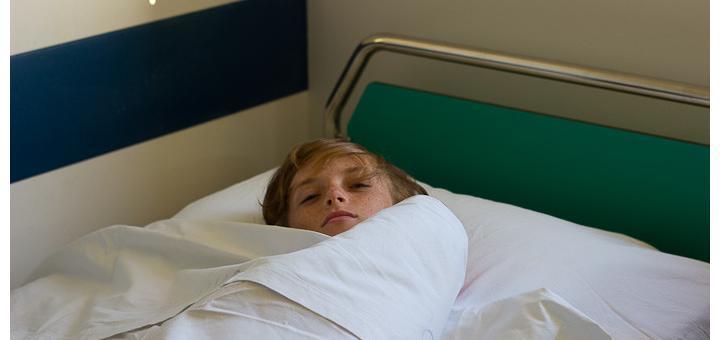 Zac in a Greek hospital bed.