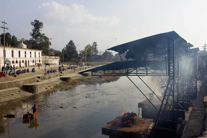A corpse burning on the funeral pyres at Pashupatinath, Nepal.