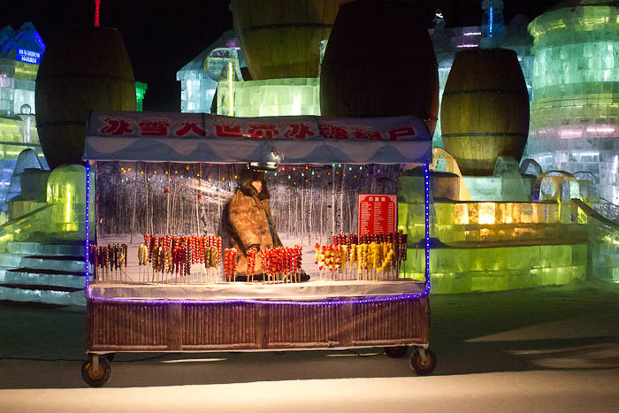 Harbin snow & ice festival - vendor selling candied hawthorn.