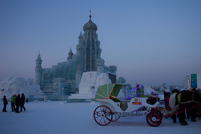 Harbin ice sculptures - Ice Palace with horse and carriage.