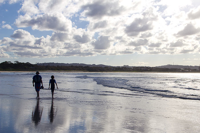 Zac and Dad on the beach at Byron Bay.