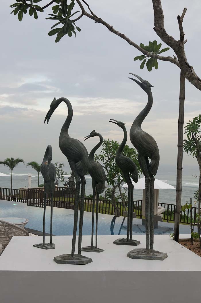 heron sculptures by the pool at samabe bali