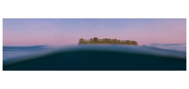 Kakaban island in Borneo's Derawan Archipelago, blurred in a wave.