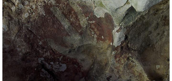 Hand stencil in the Leang-Leang caves of Maros, with truncated ring finger.