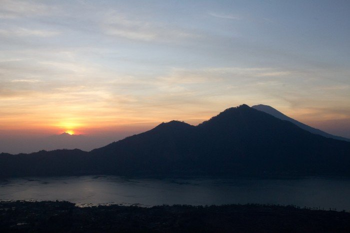 The sun rises over Gunung Rinjani, from Mount Batur, Bali.