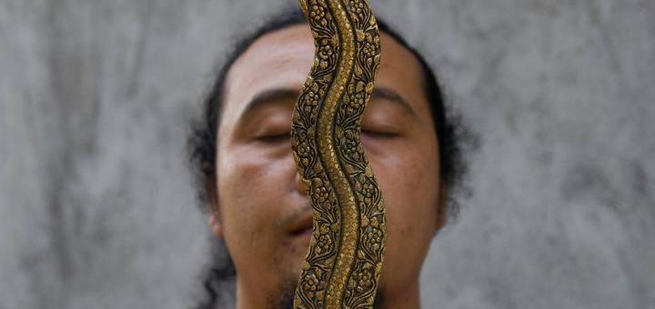 Balinese kris-maker Empu Nyoman Punduh with his masterwork.
