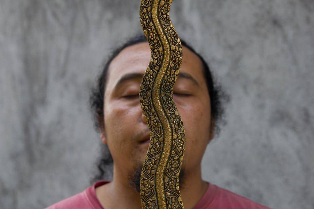 Balinese kris-maker Empu Nyoman Punduh with his masterwork.