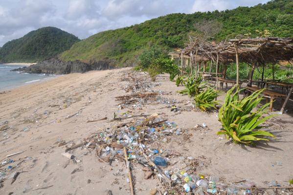 Aqua cups in the garbage on a beach in Lombok, Indonesia.
