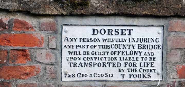 Sign threatening wayfarers in Dorset, UK.