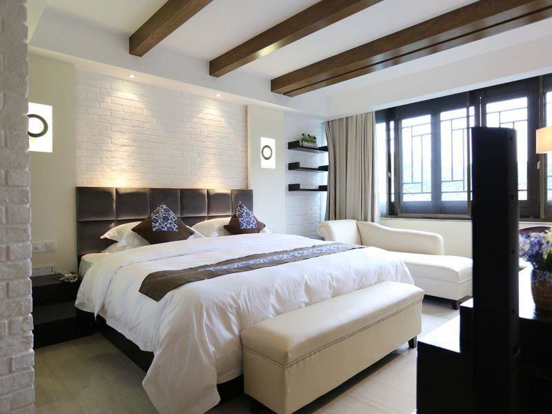 Exposed brickwork in a room at the Hangzhou Tea Villa.