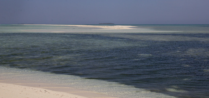 Pristine beach, seascape and island.